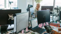 Colleagues working in a busy office