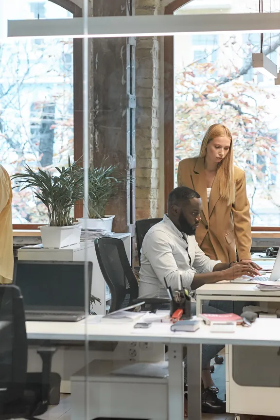 people working in an open office space environment